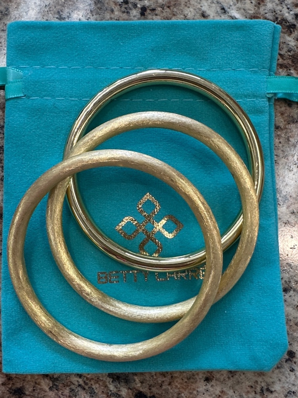 New in package. Zoey Bangles set of 3. Betty Carre. 18kt gold plated